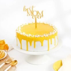 Mom’s Golden Mango Cake with layers of moist mango-infused cake and creamy frosting, beautifully decorated for special occasions.