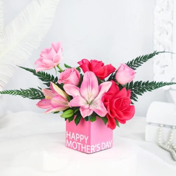 Mom's Joy Floral Arrangement featuring a vibrant mix of colorful flowers, ideal for gifts and celebrating special moments with mothers.