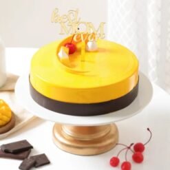 Mom's Mango Delight Cake, a beautifully decorated cake with layers of fresh mango and creamy frosting, perfect for Mother's Day.