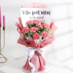 Mom's Pink Carnation Tribute featuring a beautiful arrangement of pink carnations, ideal for honoring mothers on special occasions or as a thoughtful gift.