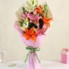 Radiant Asiatic Lily Arrangement featuring vibrant lilies in bold colors, perfect for adding beauty and elegance to any space or occasion.