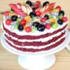 Red Velvet Fruit Cake, showcasing vibrant red velvet layers intertwined with fresh fruits, beautifully decorated for an elegant and delicious dessert.