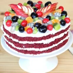 Red Velvet Fruit Cake, showcasing vibrant red velvet layers intertwined with fresh fruits, beautifully decorated for an elegant and delicious dessert.