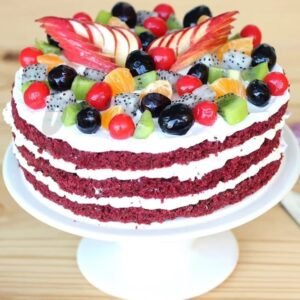 Red Velvet Fruit Cake, showcasing vibrant red velvet layers intertwined with fresh fruits, beautifully decorated for an elegant and delicious dessert.