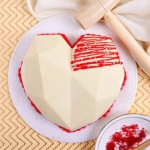 Red Velvet Heart Pinata Cake with elegant design and hidden sweet surprise inside, perfect for festive and romantic celebrations.