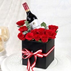 Rose Wine Bouquet featuring a beautiful arrangement of fresh roses alongside a bottle of premium rosé wine, ideal for gifts and celebrations.