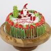 Santa Christmas Cake adorned with a cheerful Santa Claus decoration, ideal for festive celebrations, holiday parties, and family gatherings.