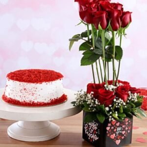 Scarlet Delight with Velvet Indulgence featuring a decadent red velvet cake paired with vibrant red roses, ideal for special occasions and gifts.