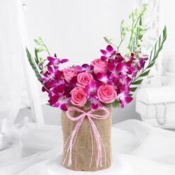 Timeless Rose and Orchid Arrangement – an exquisite floral display combining classic roses and elegant orchids, ideal for celebrating special moments.