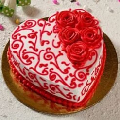 Valentine's Day Heart Cake decorated with vibrant red icing, adorned with romantic accents, ideal for celebrating love on this special occasion.