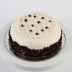 Vanilla Coffee Swirl Cake with rich coffee and creamy vanilla layers, beautifully garnished and served on a decorative plate.