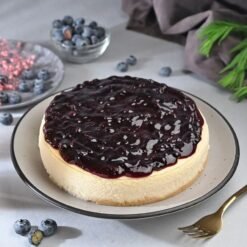 Blueberry Bliss Cheesecake – a rich and creamy cheesecake topped with fresh blueberries, ideal for dessert lovers and special occasions.