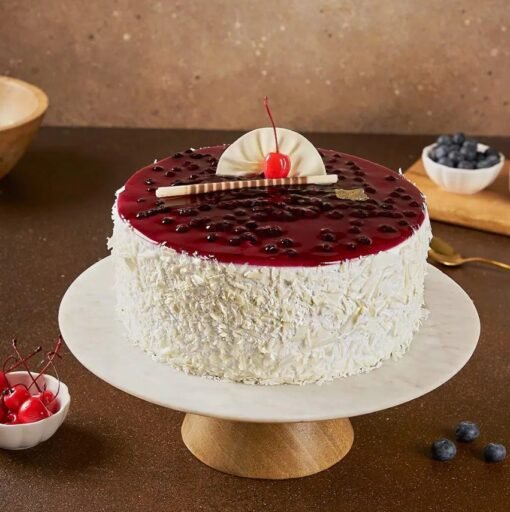 Blueberry White Velvet Cake – a creamy white cake layered with tangy blueberries, perfect for celebrations and indulgent dessert moments.