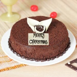 Christmas Cocoa Mud Cake, a rich chocolate cake with festive holiday decorations, ideal for cozy Christmas gatherings and indulgent celebrations.