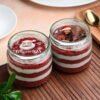 Christmas Red Velvet Jar Cakes featuring layers of red velvet cake and cream cheese frosting, ideal for holiday celebrations and gifts.