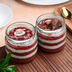 Christmas Red Velvet Jar Cakes featuring layers of red velvet cake and cream cheese frosting, ideal for holiday celebrations and gifts.