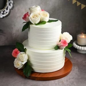 Floral Elegance Tiered Cake adorned with delicate floral decorations, featuring multiple layers of moist, flavorful cake perfect for special occasions.