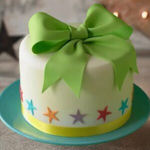 Elegant Fondant Grace Bow Cake, decorated with a delicate fondant bow, showcasing intricate craftsmanship and perfect for special celebrations.