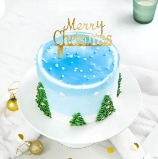 Frosted Christmas Tree Cake decorated with a snowy tree design, perfect for adding festive charm to your Christmas celebrations.