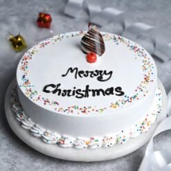 Joyful Christmas Vanilla Cake – a festive vanilla cake decorated for the holidays, perfect for joyful Christmas celebrations and gatherings.