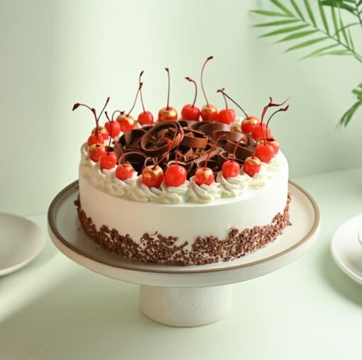 Luxurious Black Forest Cake – a decadent layered chocolate cake with cherries and whipped cream, ideal for indulgent celebrations and special occasions.