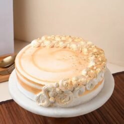 New Year Butterscotch Dream cake with creamy butterscotch layers and festive decorations, ideal for New Year’s Eve parties and gatherings.