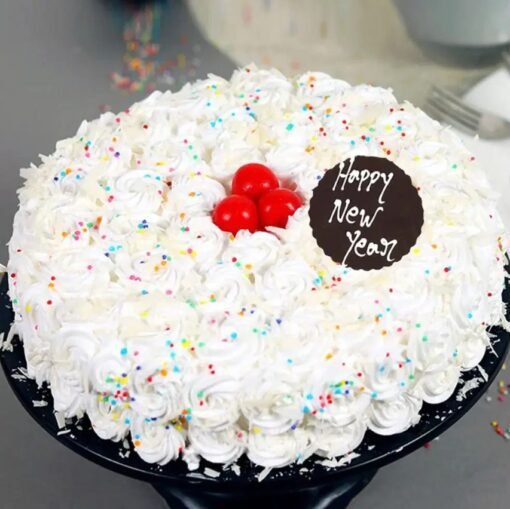 New Year Snowfall Cake with a delicate snowy finish and festive decorations, bringing a winter wonderland touch to your New Year celebration.