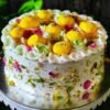 Pistachio Rose Rasmalai Cake, a fusion dessert with layers of pistachio, rose, and rasmalai flavors, perfect for festive celebrations.