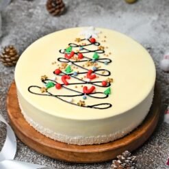 Radiant Vanilla Christmas Cake decorated with festive elements, ideal for holiday celebrations and adding a touch of elegance to your dessert table.