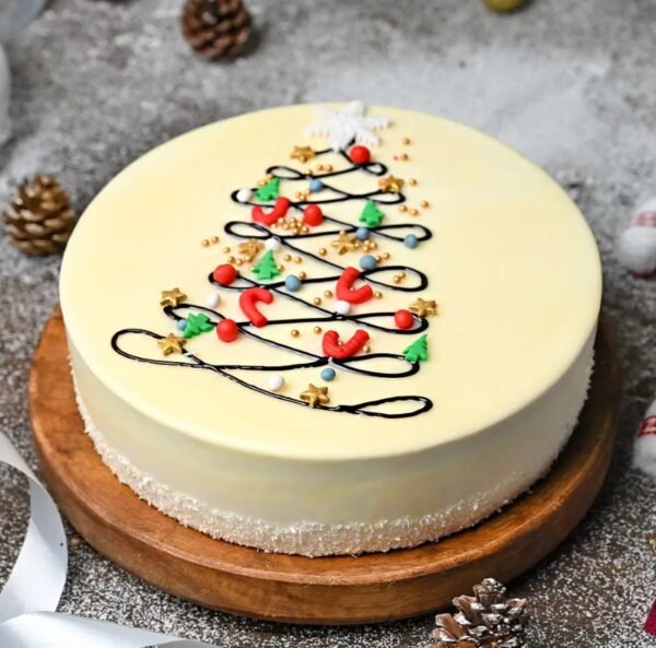 Radiant Vanilla Christmas Cake decorated with festive elements, ideal for holiday celebrations and adding a touch of elegance to your dessert table.