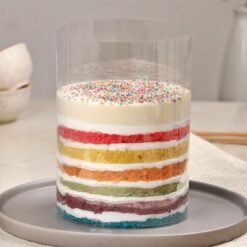 Rainbow Bliss Pull-Up Cake with vibrant rainbow layers, perfect for birthdays, celebrations, and fun events that delight all ages.