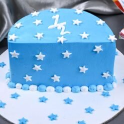 Starry Blue Vanilla Half Cake with soft vanilla layers, blue icing, and starry decorations, perfect for birthdays or dreamy occasions.