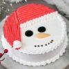 Vanilla Santa Delight Cake – a holiday cake with creamy vanilla flavor and Santa-themed decorations, perfect for Christmas celebrations.