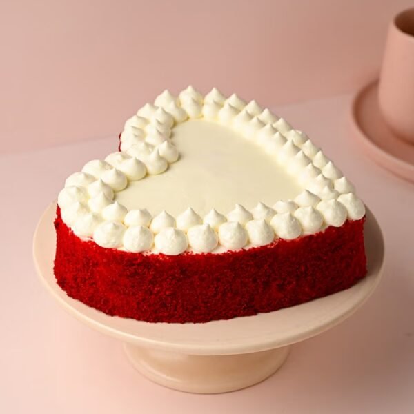 Velvet Heart Delight Cake, a heart-shaped red velvet cake with creamy layers, ideal for romantic celebrations and special moments.