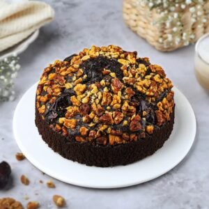 Walnut Date Delight Cake beautifully decorated with walnuts and dates, showcasing a moist dessert ideal for celebrations or cozy gatherings.