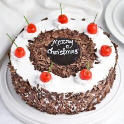 Xmas Blackforest Cake featuring layers of chocolate, cherries, and whipped cream, beautifully decorated for Christmas celebrations.