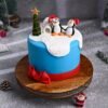 Snowy Bliss Christmas Cake adorned with snowy decor, creating a festive and delightful holiday dessert.