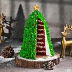 Red Velvet Christmas Tree Cake with red velvet layers and festive tree-shaped design, perfect for Christmas celebrations.