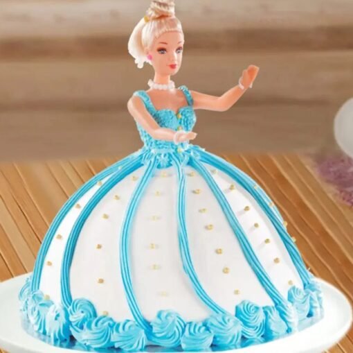 A beautifully designed Blue Barbie Doll Cake featuring an elegant Barbie doll with a flowing blue gown made of cake and frosting.