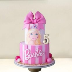 A beautifully designed Dazzling Barbie Tier Cake featuring elegant layers, pink hues, and intricate Barbie-inspired decorations.