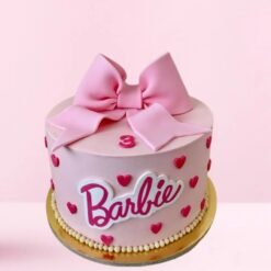 A charming Pink Bow Barbie Cake with a cute Barbie figure and a stunning pink bow, creating a perfect combination of elegance and fun for any celebration.