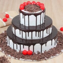 Luxe Black Forest Tier Cake with layers of decadent chocolate, cherries, and whipped cream, beautifully decorated for a luxurious celebration.