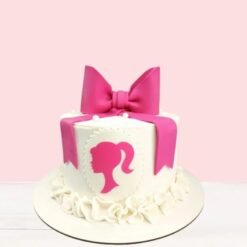 A beautifully crafted Luxe Barbie Bow Cake with a stylish fondant bow and pink hues, perfect for Barbie-themed celebrations.