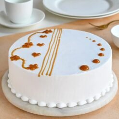 Vanilla Caramel Fantasy Cake with fluffy vanilla sponge, rich caramel glaze, and a decorative caramel drizzle for a perfect dessert.