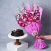 Decadent chocolate cake with a bouquet of elegant orchids, a perfect gift combo for special occasions.