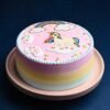 Magical Unicorn Cake with pastel swirls, a golden horn, and colorful decorations, ideal for birthdays and special occasions.