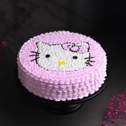 Pink Hello Kitty Cake with intricate fondant details, perfect for Hello Kitty fans and birthday celebrations.