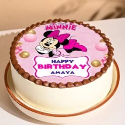 A beautifully designed Pretty Pink Minnie Cake featuring Minnie Mouse-inspired decorations in shades of pink, perfect for birthdays and themed parties.