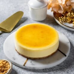 Opulent New York Cheesecake with creamy texture and decadent crust, perfect for celebrations and special events.