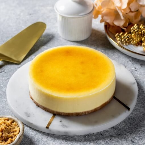 Opulent New York Cheesecake with creamy texture and decadent crust, perfect for celebrations and special events.